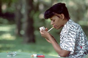 How Dare You! An African-American woman lighting up in a park - soon to be banned. (c) Bill Branson/WikiCommons